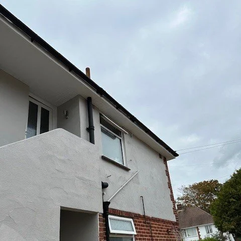side view of the property just painted and fitted with new fascias and guttering 