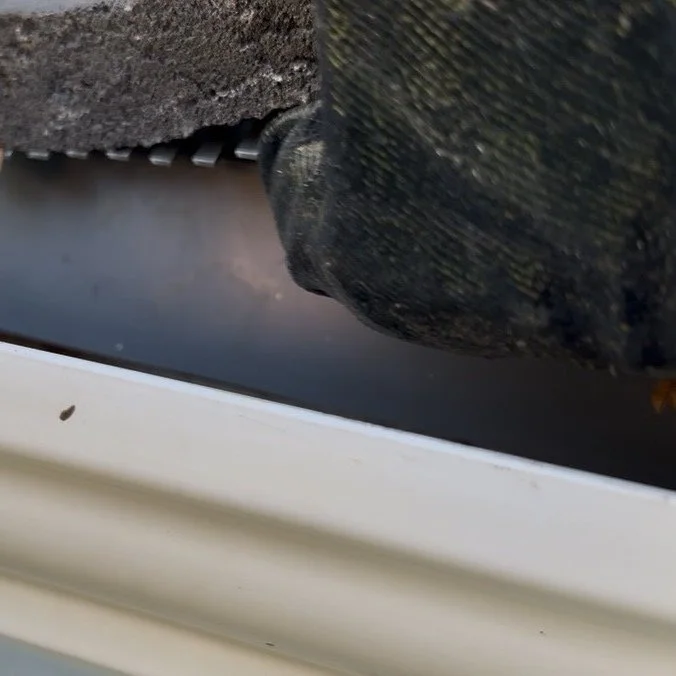 Image shows fitting metal birdcomb to roof
