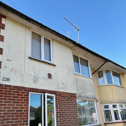 image showing the front of a 3 bed house before it is painted