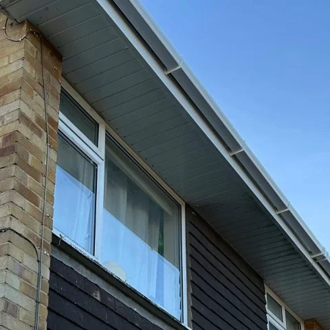 Image shows the side of a propety in Southampton Hampshire after white UPVC square guttering replacement and soffit and fascias replacement