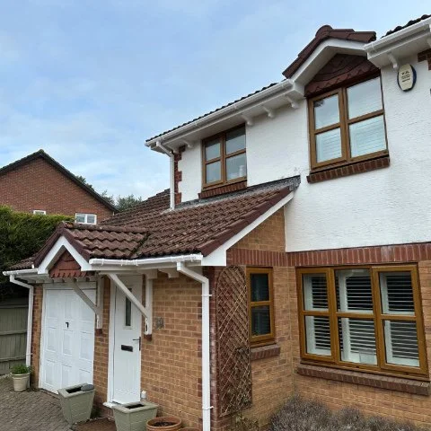 Front and side view of porch on property in Broadstone Poole with new UPVC Fascias and Soffits and white square guttering