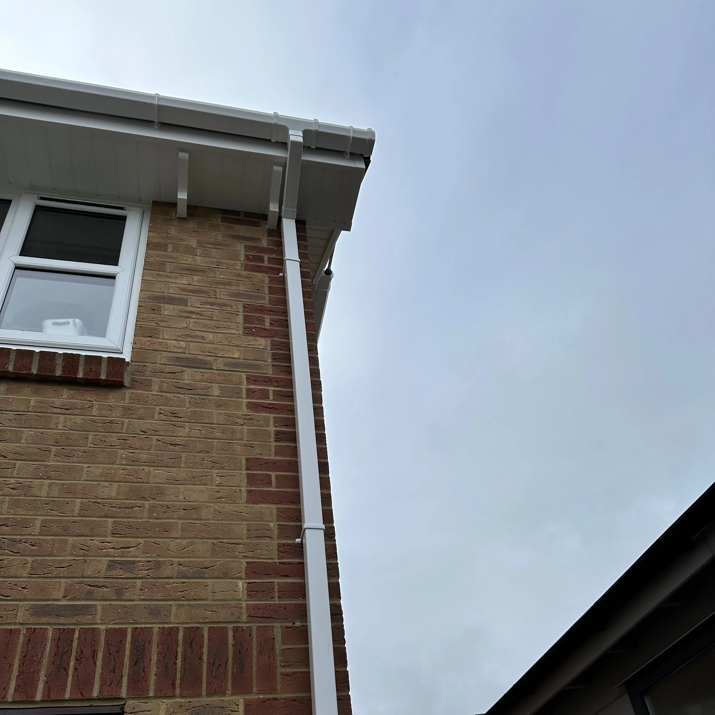 White UPVC square downpipe on house in Broadstone Poole