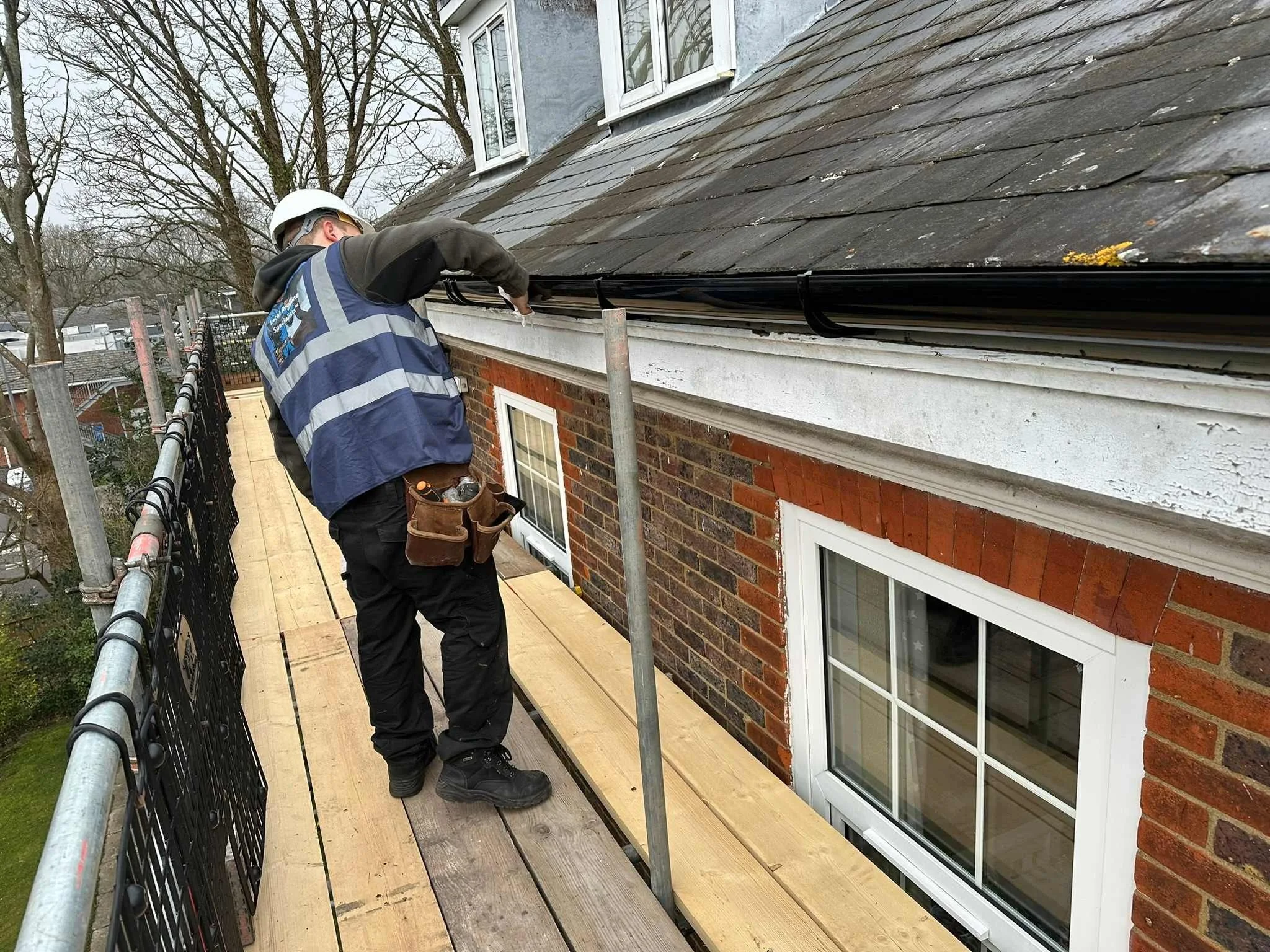 deep flow gutter installed and being cleaned.jpg