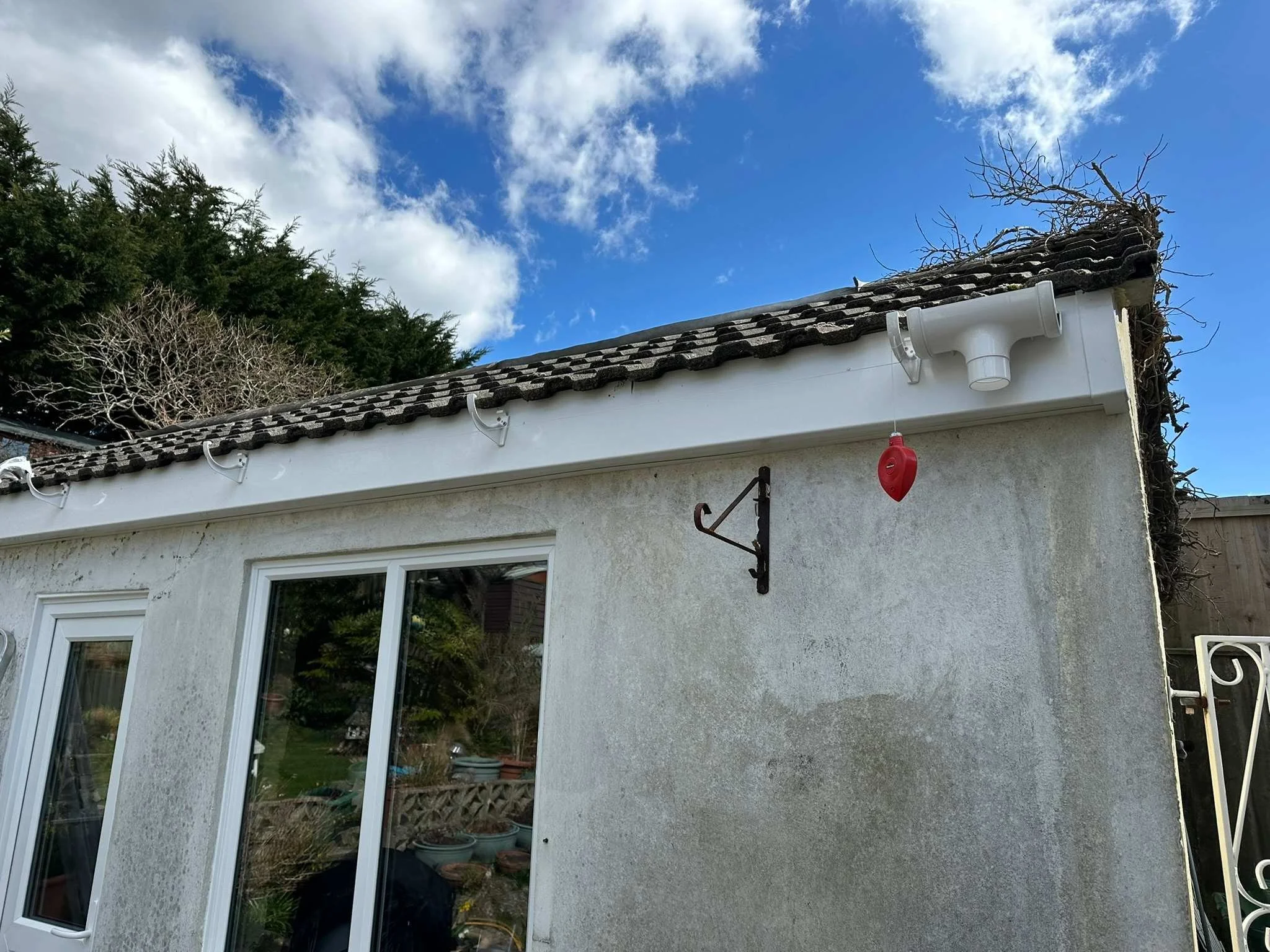 new fascia and guttering installed with string line.jpg