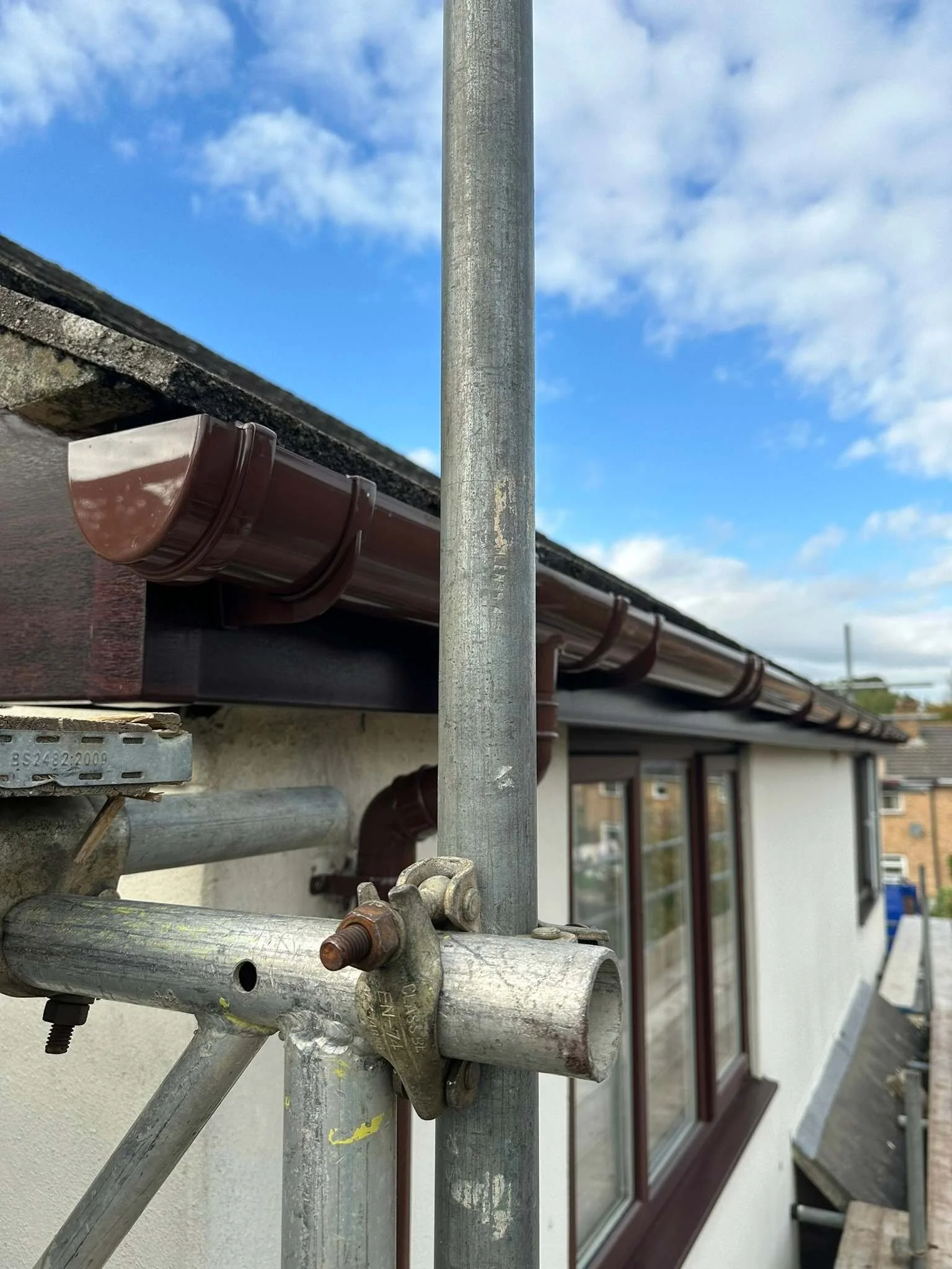 brown deep flow guttering with matching fascias and soffits.jpg
