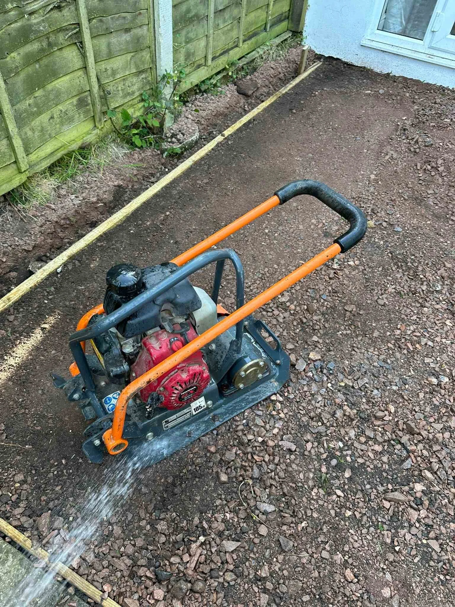 compressing MOT using a compactor and water.jpg