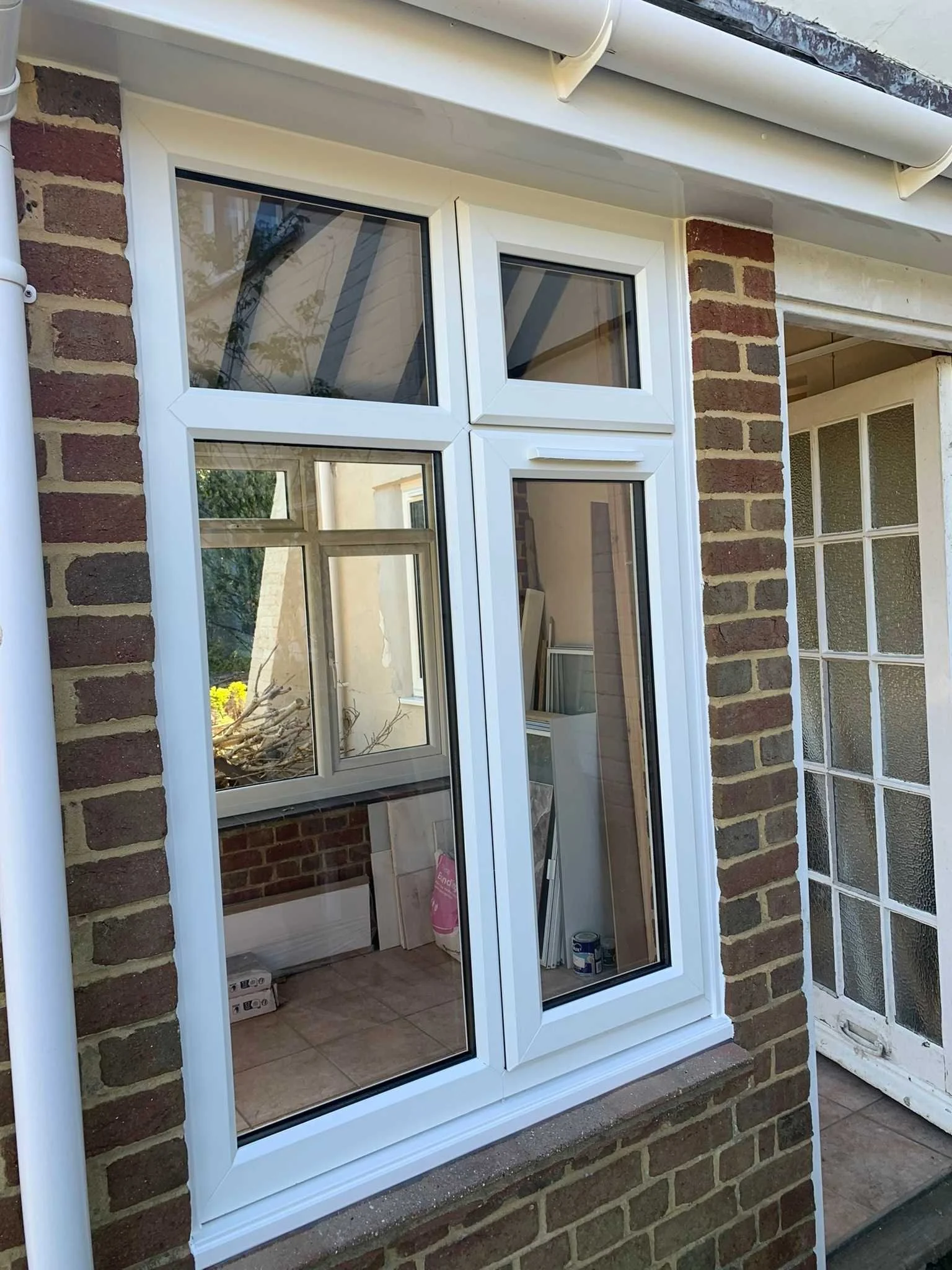 white double glazed window with white UPVC fascia and White plain soffits with white half round gutter(1).jpg