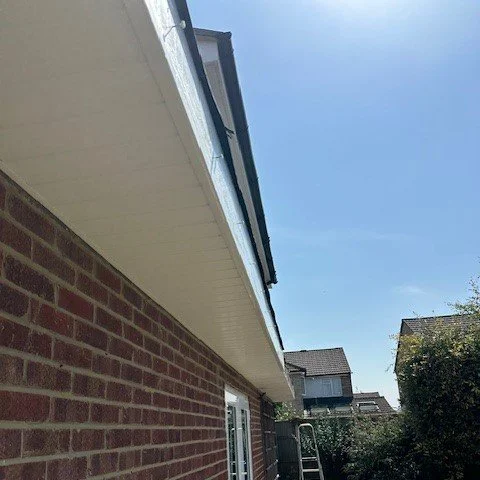 new white fascias and soffits fitted to the side of the bungalow awaitng the fitment of new guttering