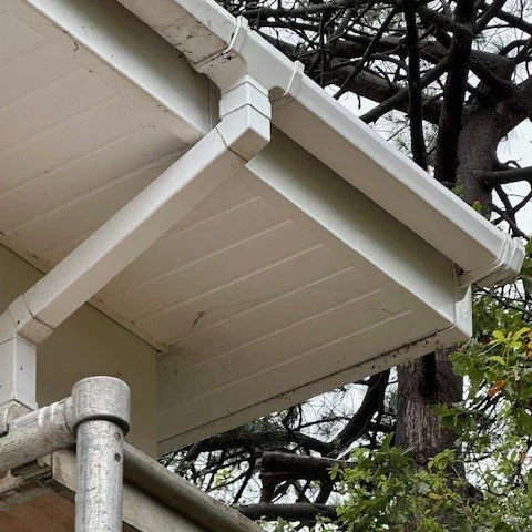finished view of the corner of the property following repair of damaged fascias and gutters caused by a squirrel