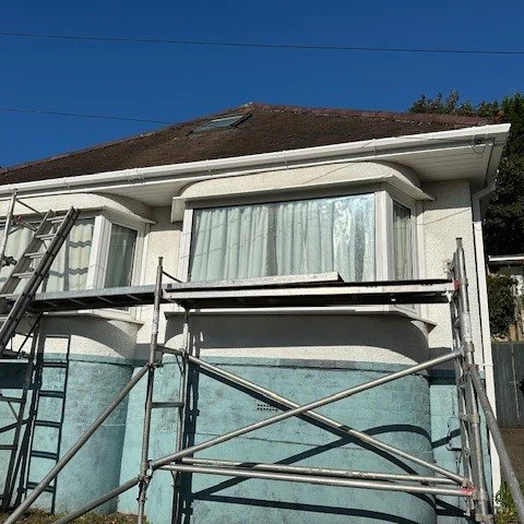 front view of the bungalow with scaffold set up and newly fitted upvc fascia and guttering