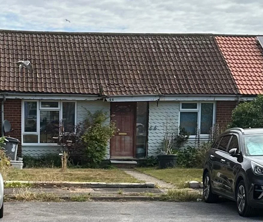 Before - rotten roofline and rotten porch structure.jpg