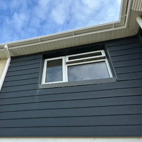 front view of a semi-detached property in Poole fitted with new white UPVC fascias and white square UPVC  guttering and white square UPVC downpipes 