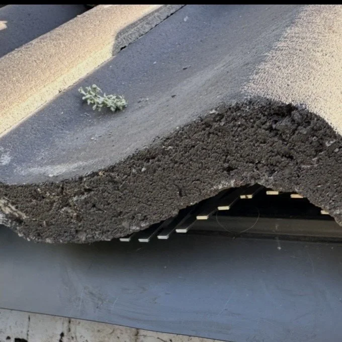 image shows metal birdcomb fitted under tiles