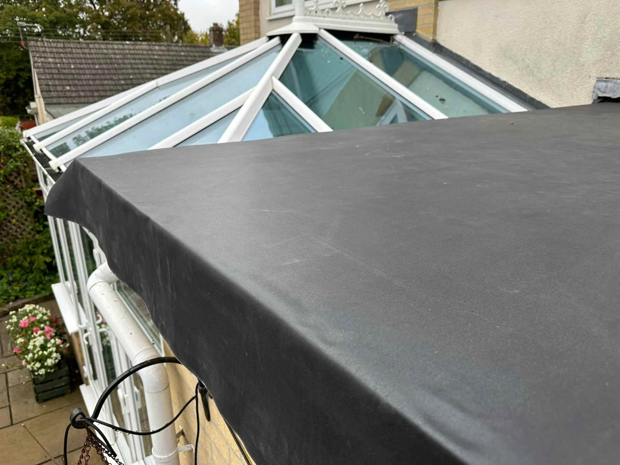 EPDM left to relax on roof prior to fitting.jpg