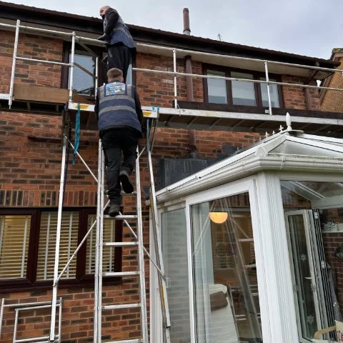 Using our scaffolding equipment over the conservatory on a detached property in Poole Dorset to replace fascias and soffits