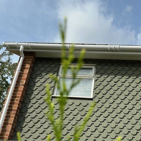 front view of the property showing newly fitted white deep flow guttering and a new white down pipe