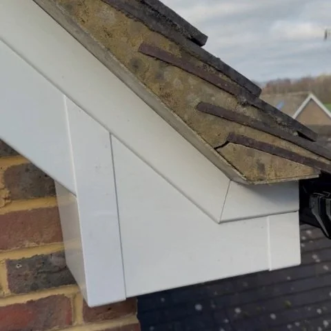 Image shows close up of replacement white UPVC bargeboards and box ends on home in Wimborne Dorset