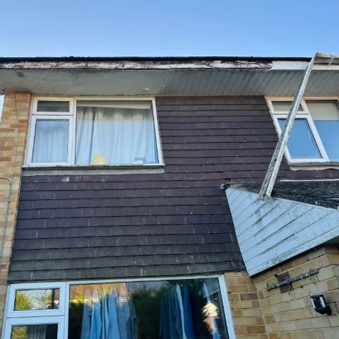 Showing the front of a propety in Southampton Hampshire with fallen guttering repair and rotten soffits before replacement