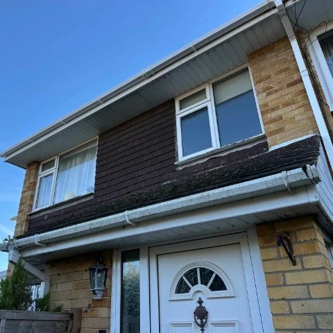 Image shows the front of a property in Southampton Hampshire after white square UPVC guttering replacement, white UPVC fascias and white UPVC tongue and groove soffit replacement