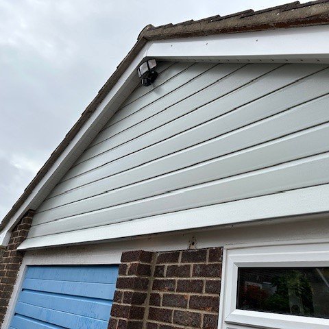 side view of the garage fitted with new agate grey shiplap cladding