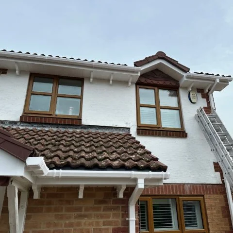 Showing property in Broadstone Poole with new UPVC Fascias and Soffits and white square guttering and access ladder