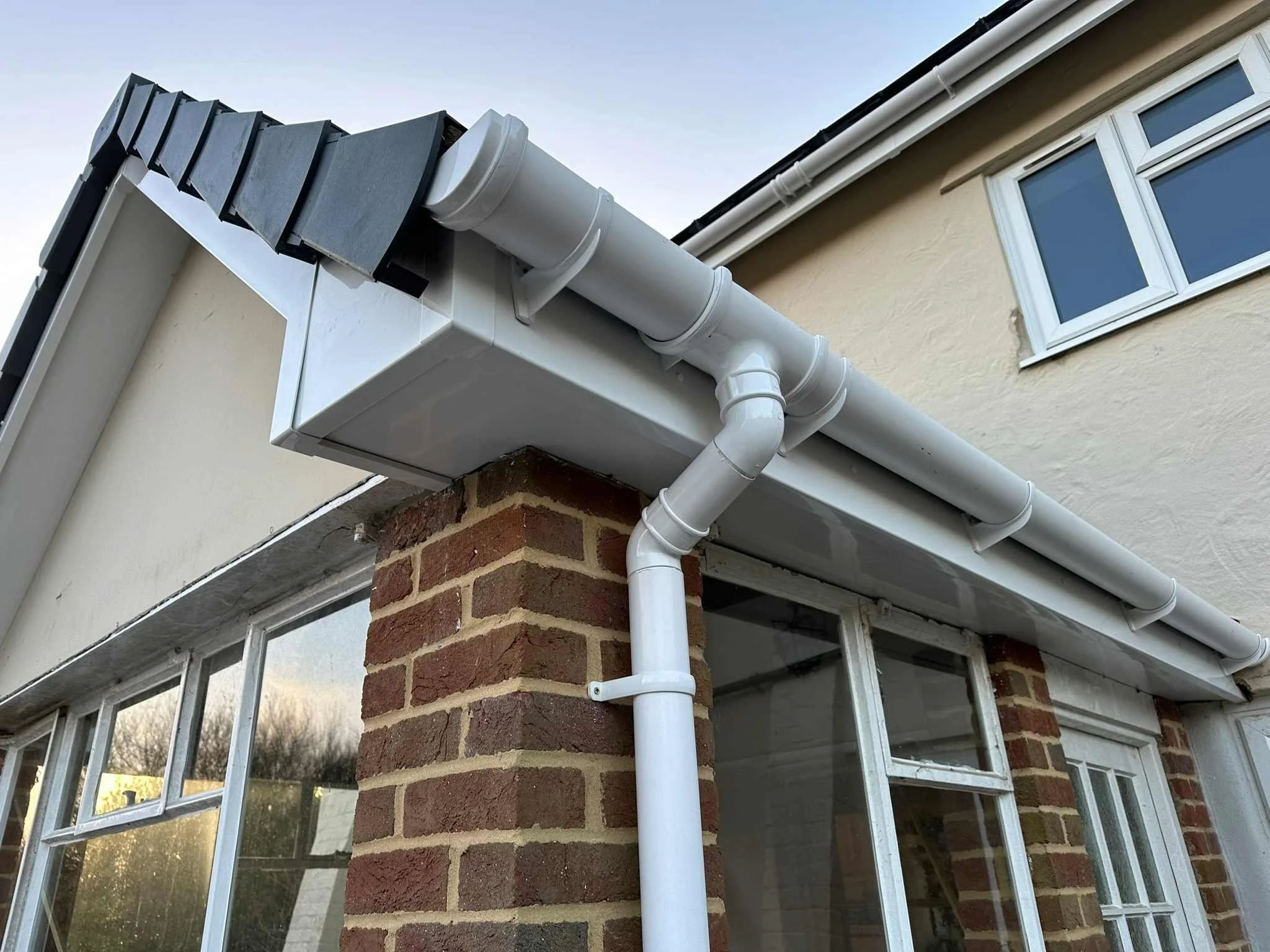 white UPVC fascias and white UPVC flat soffits with half round guttering.jpg
