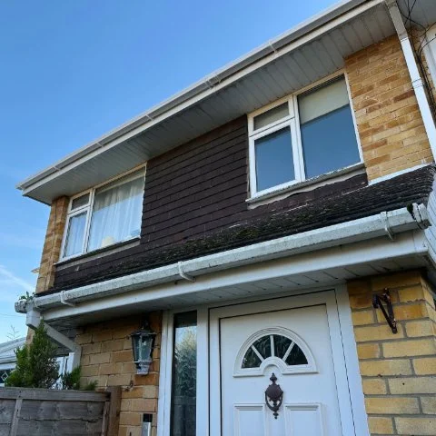 Image shows the front of a property in Southampton Hampshire after white UPVC square guttering replacement and soffit and fascias replacement
