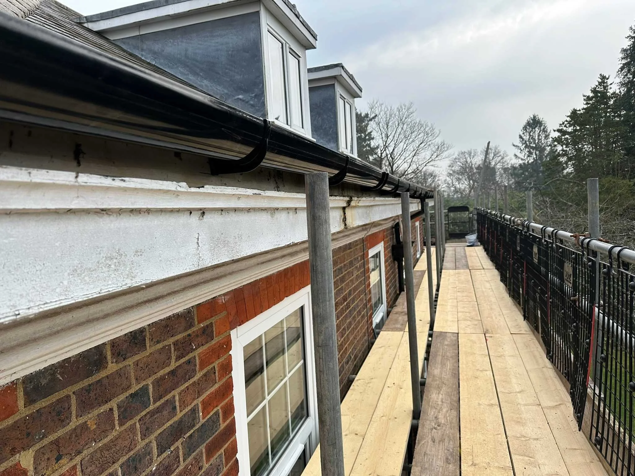 Black deep flow gutters installed to the correct fall.jpg