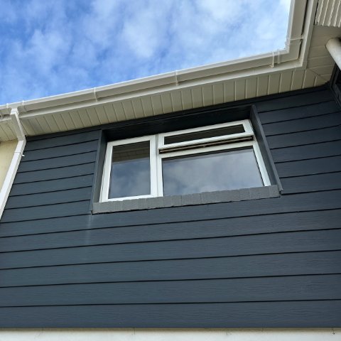 front view of a semi-detached property in Poole fitted with new white UPVC fascias and white tongue and groove soffits