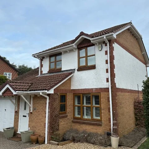 Front and side view of detached property in Boardstone Poole with new white fascias and soffits