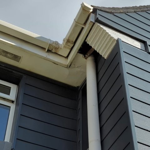 front view of a semi-detached property in Poole with broken soffits before soffit and fascia replacment