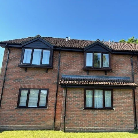 Rosewood Bargeboards Rosewood Fascia and Soffits, Black Guttering.jpg