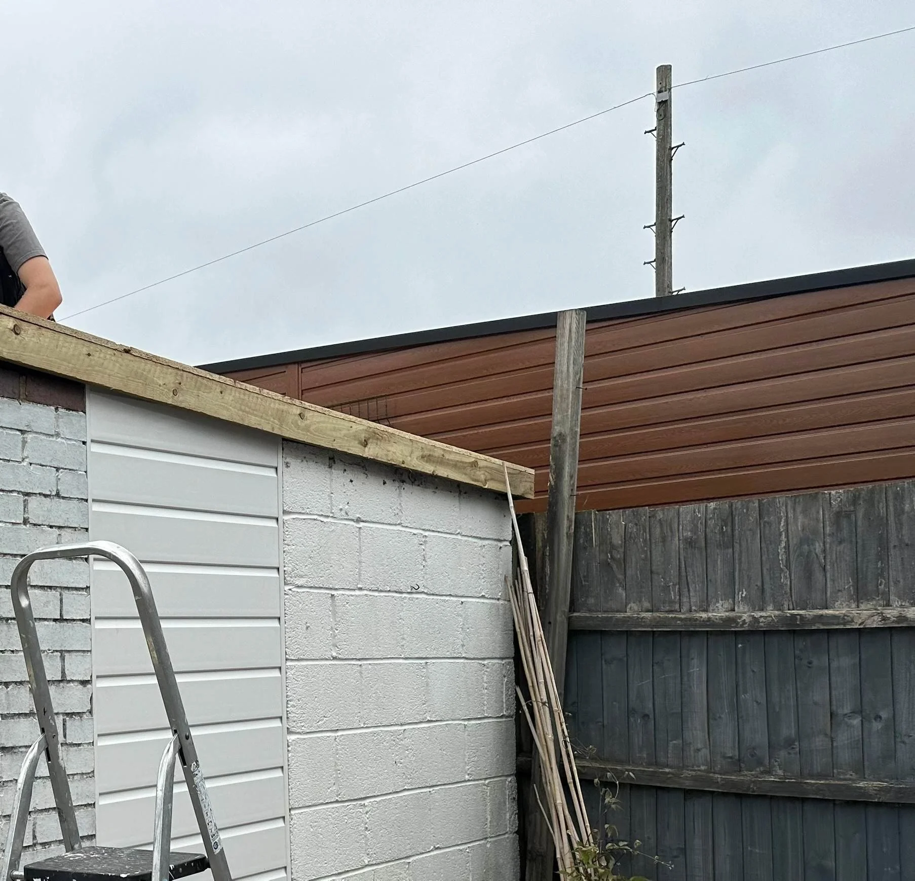 shiplap cladding to fill in door and first fix treated fascia.jpg