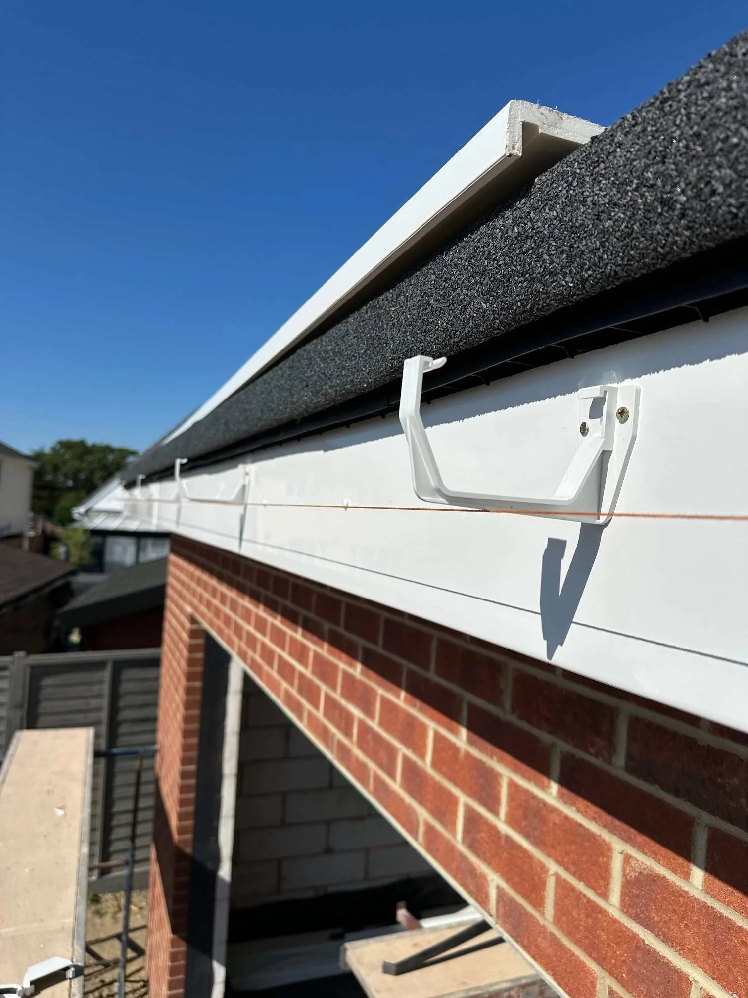 New UPVC Guttering aligned with a string line.jpg