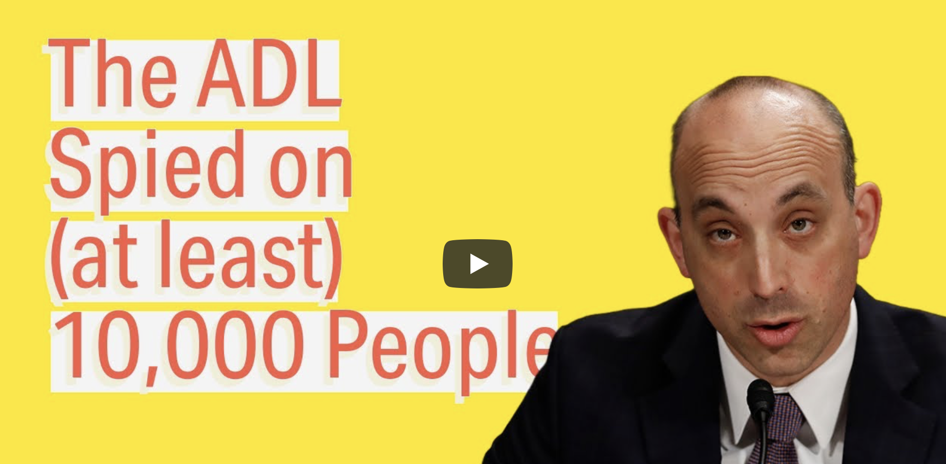 Video thumbnail featuring a bald man in a suit speaking at a microphone beside text reading “The ADL Spied on (at least) 10,000 People.”