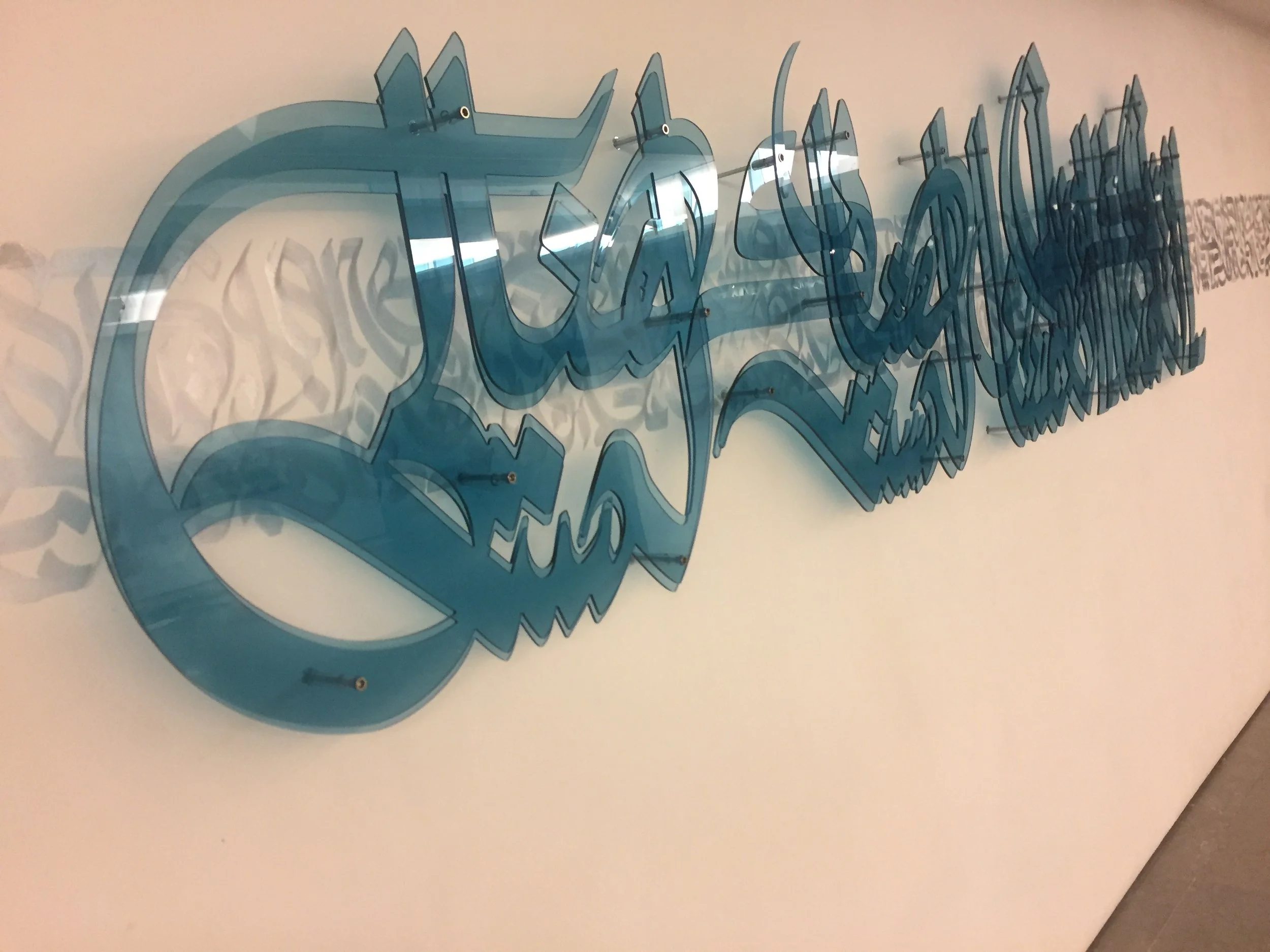 “I am from there. I am from here.
I am not there and I am not here.
I have two names, which meet and part,
and I have two languages.
I forget which of them I dream in.”
Mahmoud Darwish

Plexiglass Calligraffiti installation by Dema One commissioned f