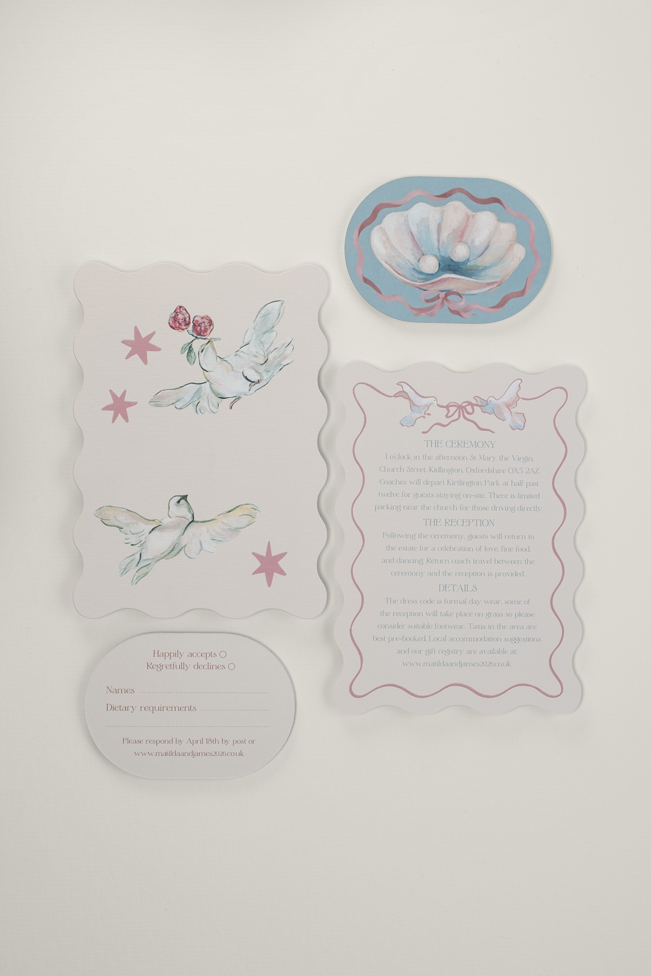 Flat lay of the Coquette double-arched RSVP card and wavy-edge details card, displaying the hand-painted pearl, shell, and lovebird artwork, with the typeset reverse sides.