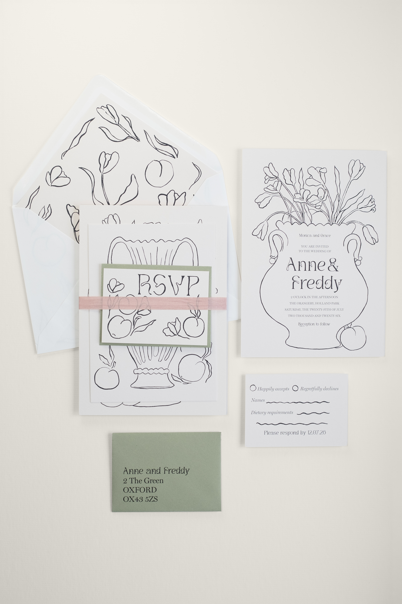 The Tulips wedding invitation suite bound by a pink closed-edge Habotai silk ribbon, displayed beside the flat-laid RSVP and invitation reverse details and envelope.