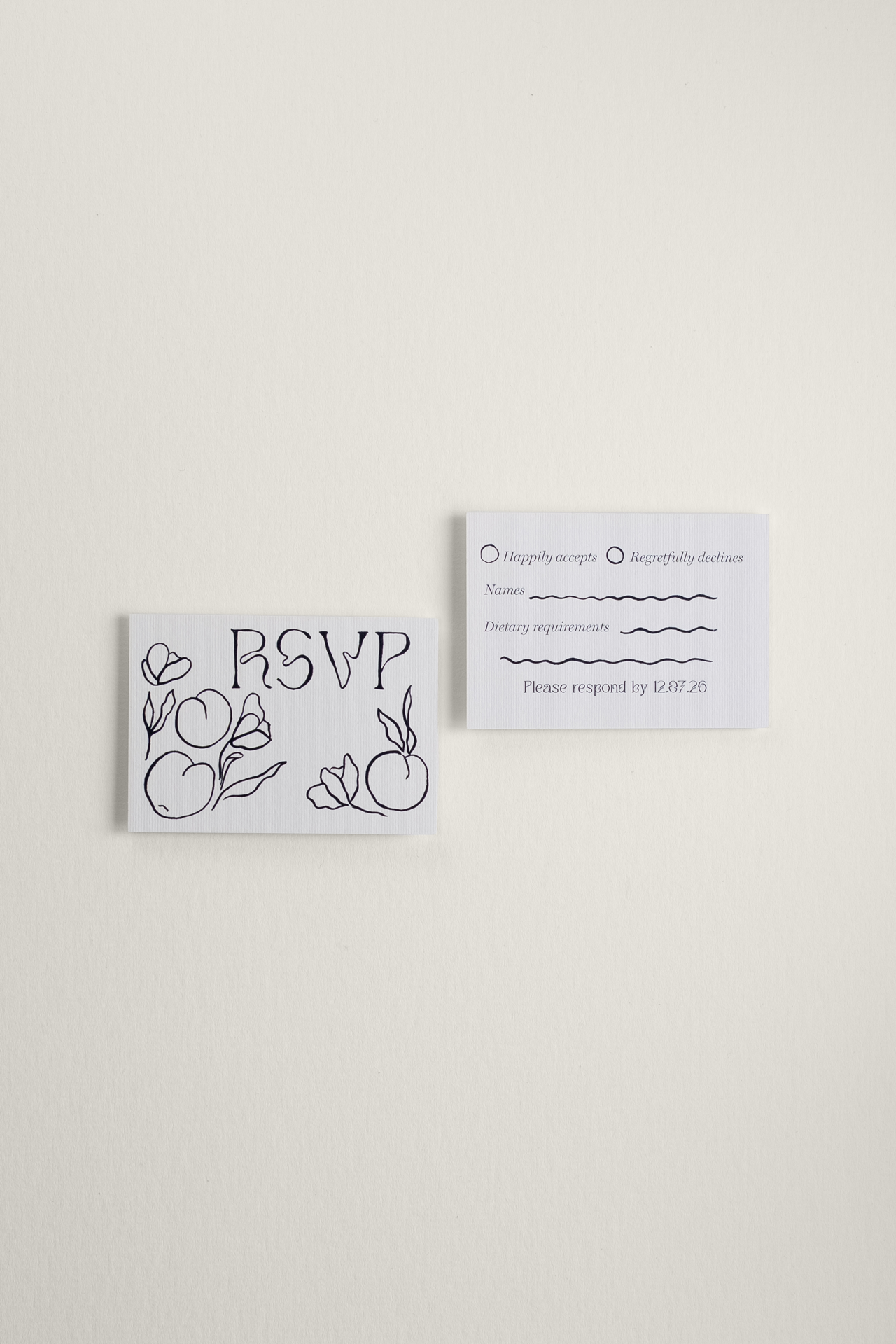 Front and reverse view of the Tulips wedding RSVP card, showcasing a whimsical hand-painted black ink illustration of tulips and fruit alongside a clean guest response layout.