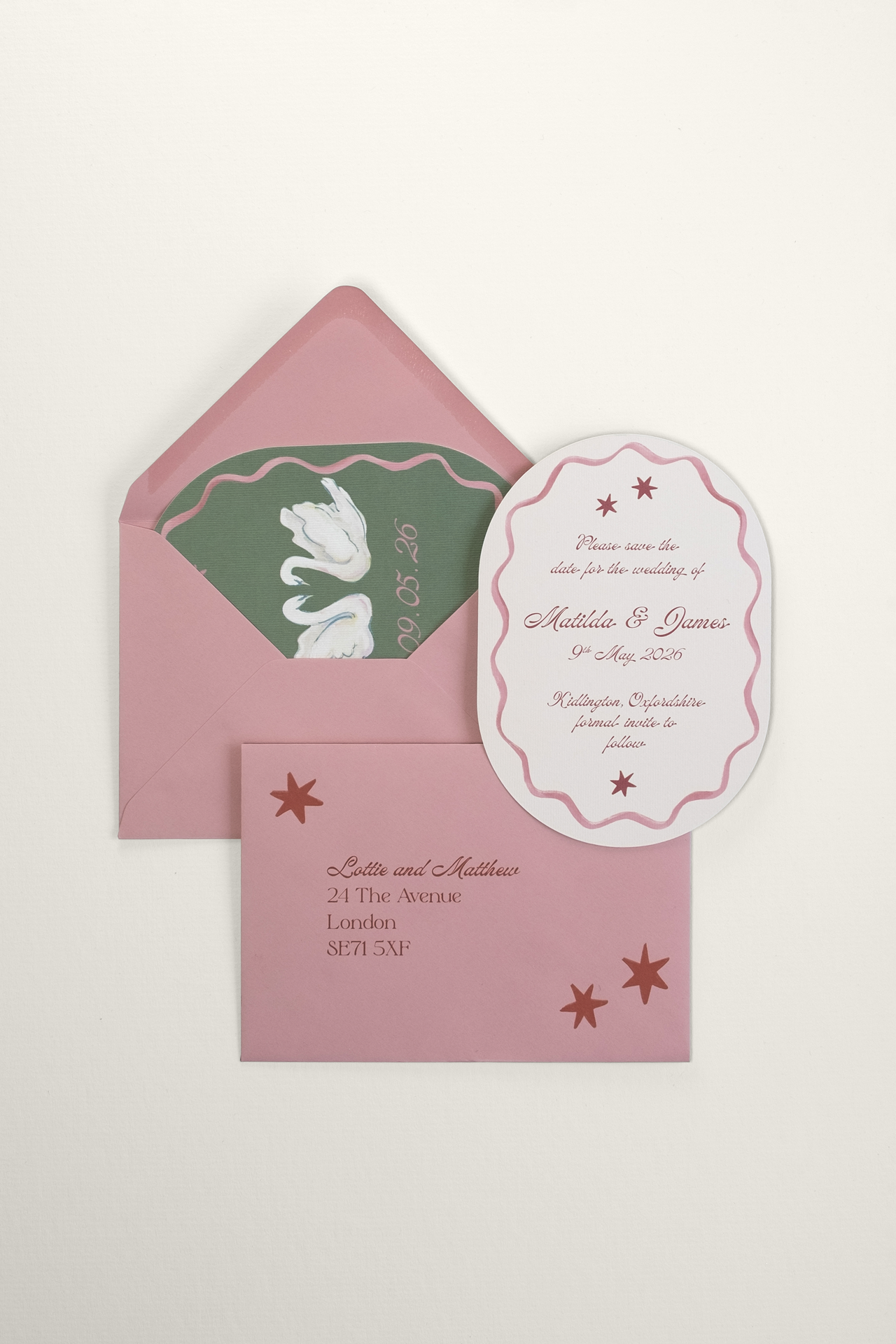 Custom addressed soft pink envelope with a Coquette Save the Date tucked inside, with the romantic typeset reverse side resting on top to show the fairytale design aesthetic.