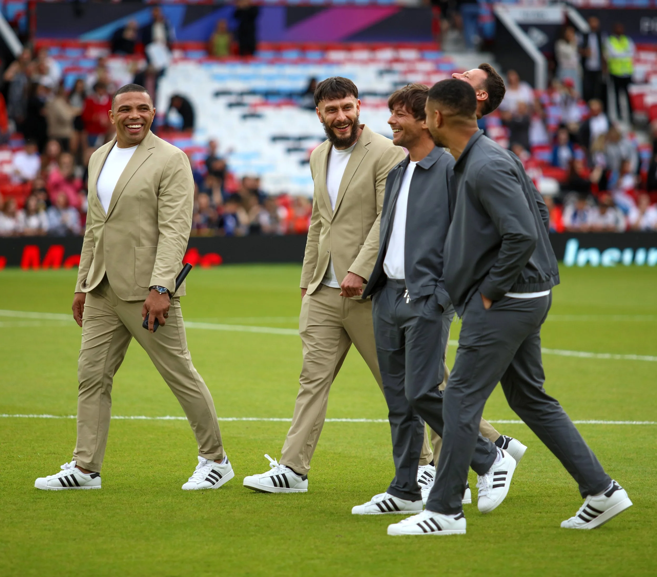 Stars share a chuckle pitch walk prior to kickoff.jpg