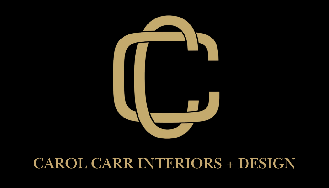 Gold logo for Carol Carr Interiors + Design with serif text on black ground