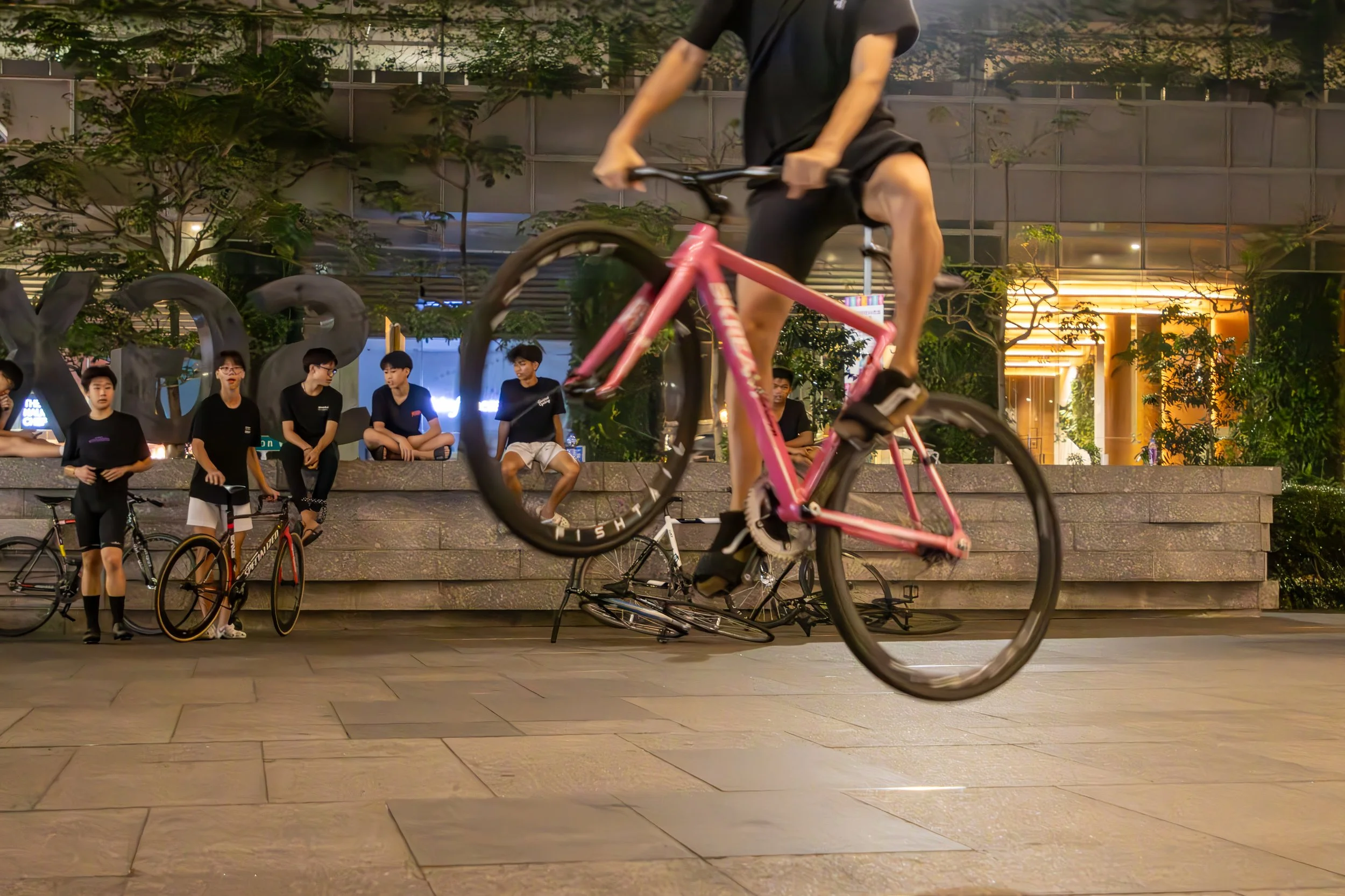 When the business day has ended in Sigapore's financial district the ciry is taken by a different kind of performers. Beneath the towers of Shenton Way fixed-gear cyclists gather to transform this urban landscape into a space for balance and skill.