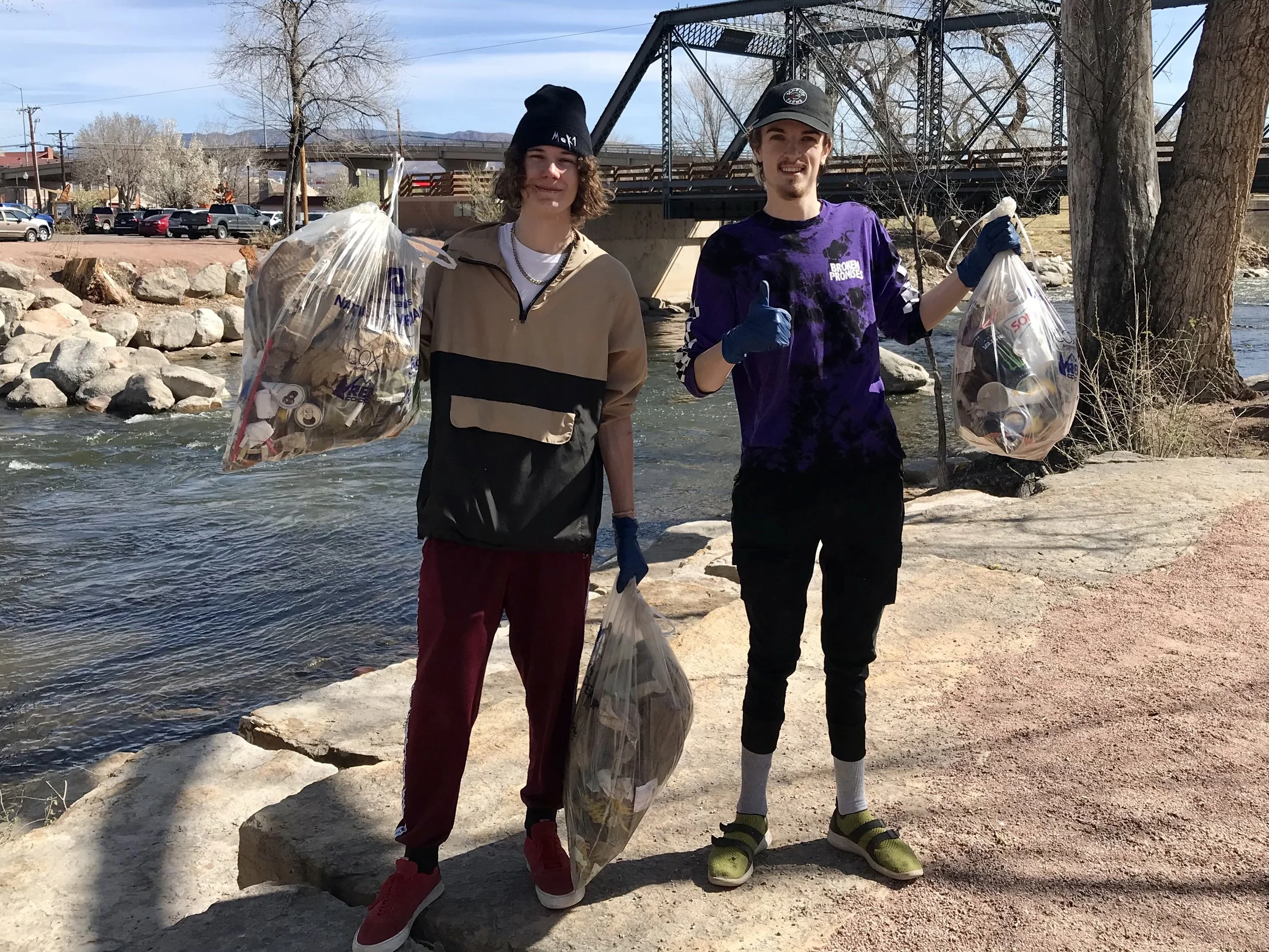 Ashton Welch and Jayden Morgan collecting trash at the First Annual RG RIO river clean-up event