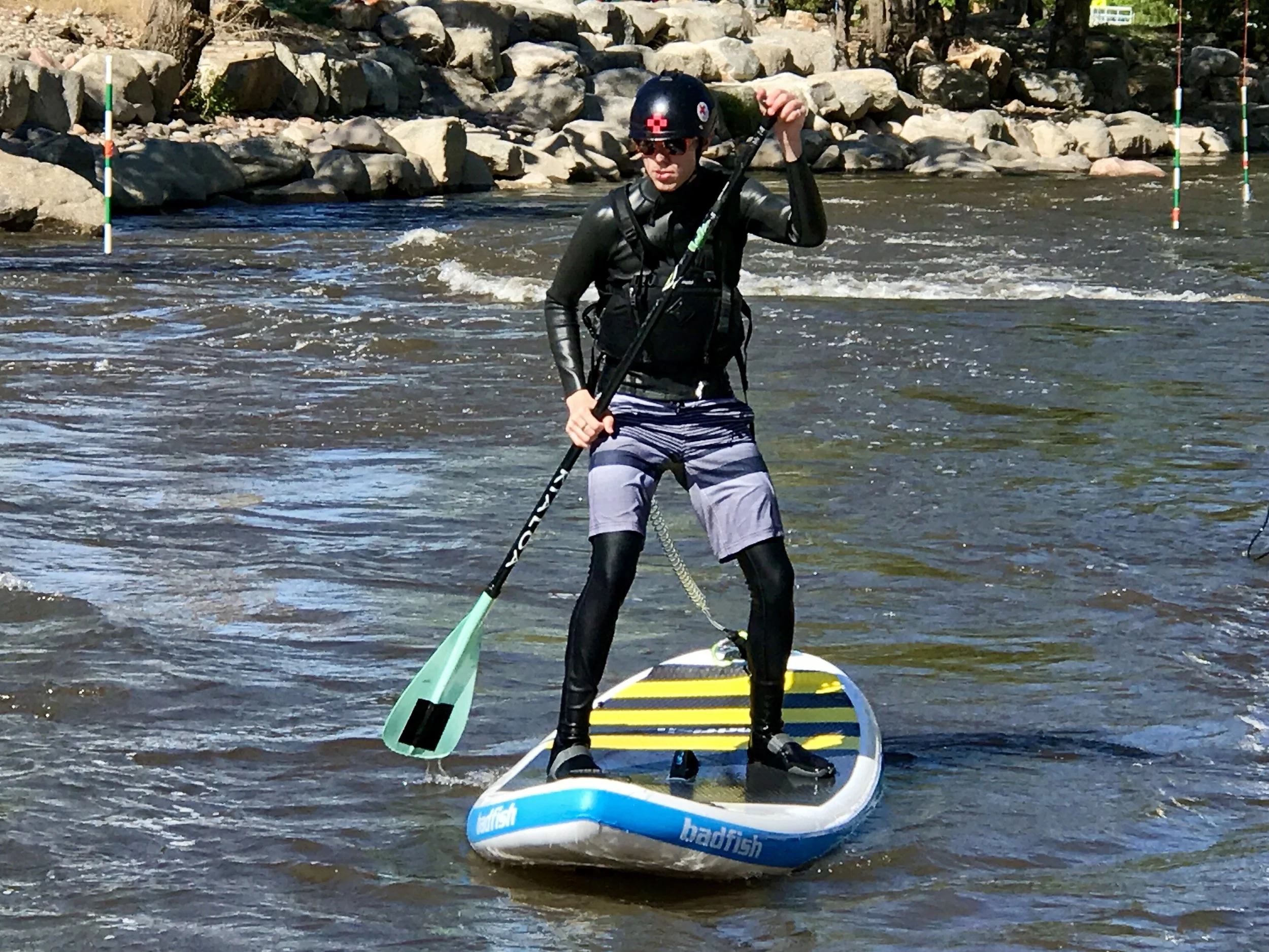 Ashton Welch at the Canon City Whitewater Park doing some river SUP