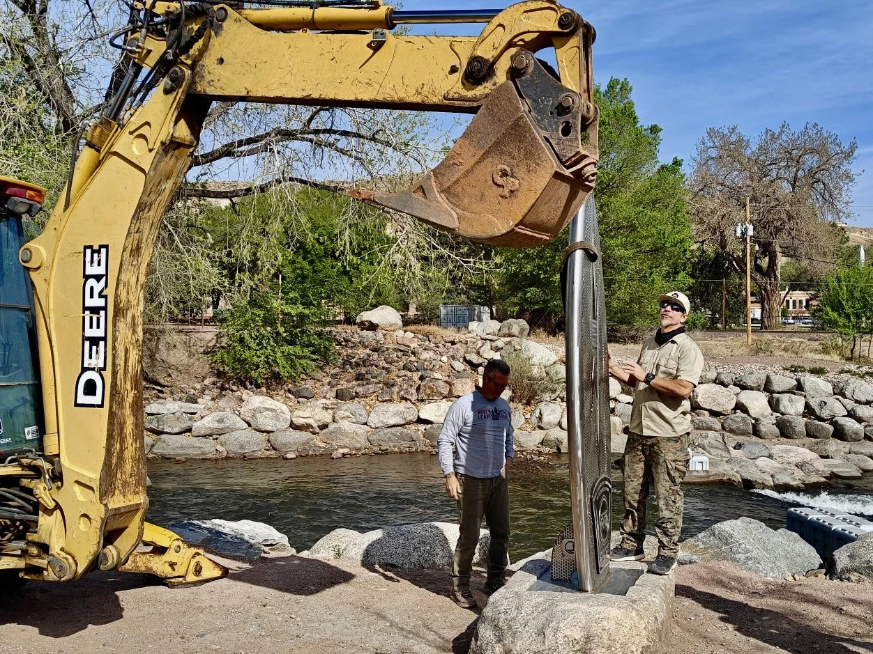 Martin Welch and Warren Hart working to get the sculpture installed