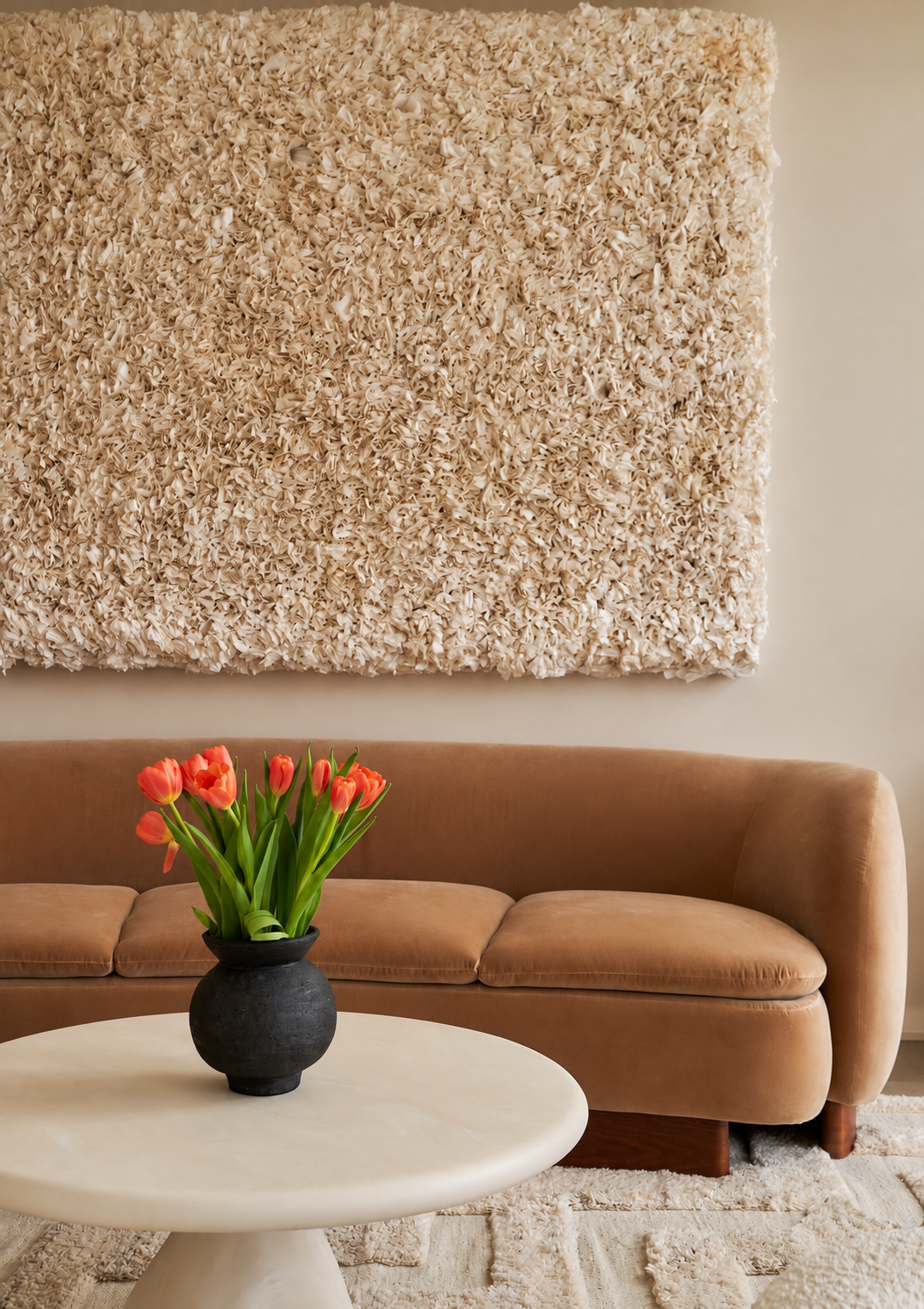 Textured Wall Art and Tulips in a Cozy Living Room.png