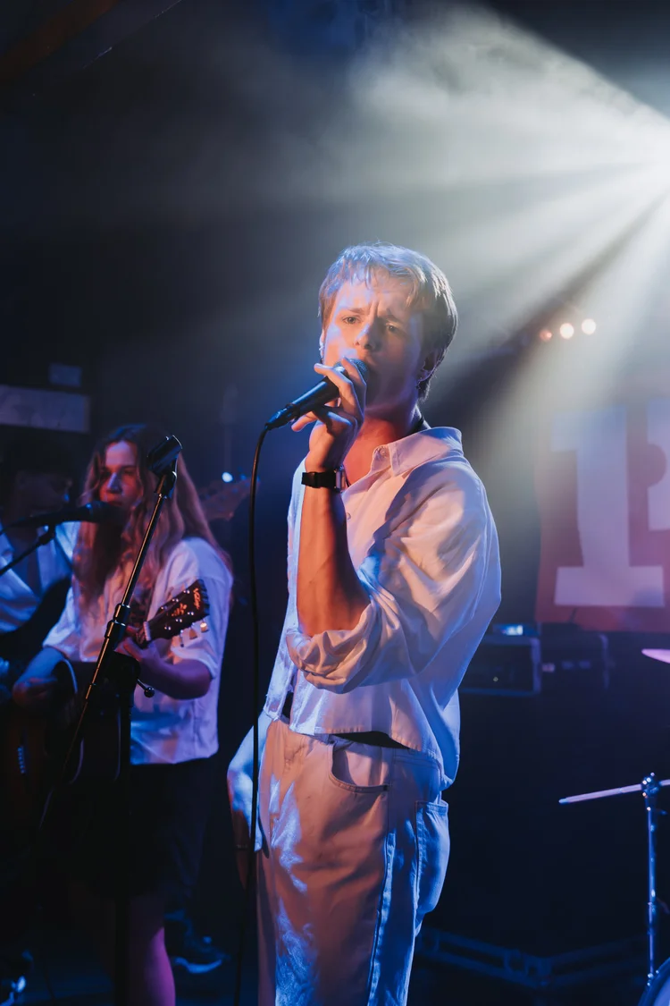 A singer performing live on stage