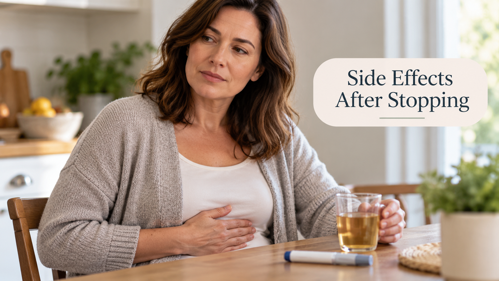 Woman experiencing stomach discomfort, illustrating potential side effects after stopping Wegovy or semaglutide treatment