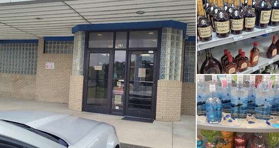 Outside of a store with a glass door, displaying bottles of alcohol and water bottles on shelves and in cups.